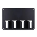 Black plastic wall-mounted rack holding four electric hair clippers for salon or home storage