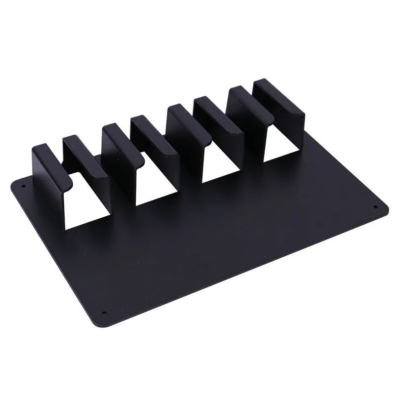 Black plastic wall-mounted rack holding four electric hair clippers for salon or home storage