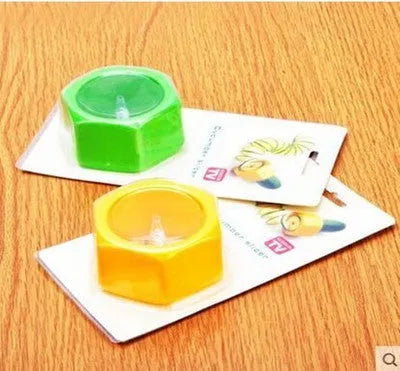 Yellow and green plastic spiral vegetable cutter for cucumbers measuring 8cm diameter