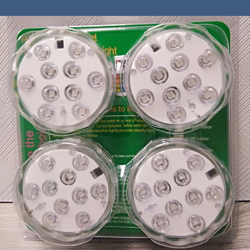 White waterproof LED pool light with remote control on a table