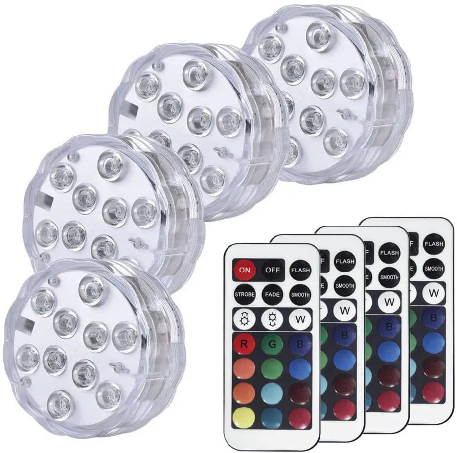 White waterproof LED pool light with remote control on a table