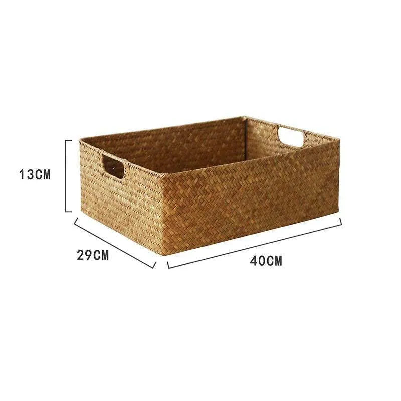 Handmade straw woven rectangular storage basket in natural grass fibre on a shelf