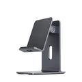 Alloy mobile phone holder bracket in dark space grey colour on a desktop