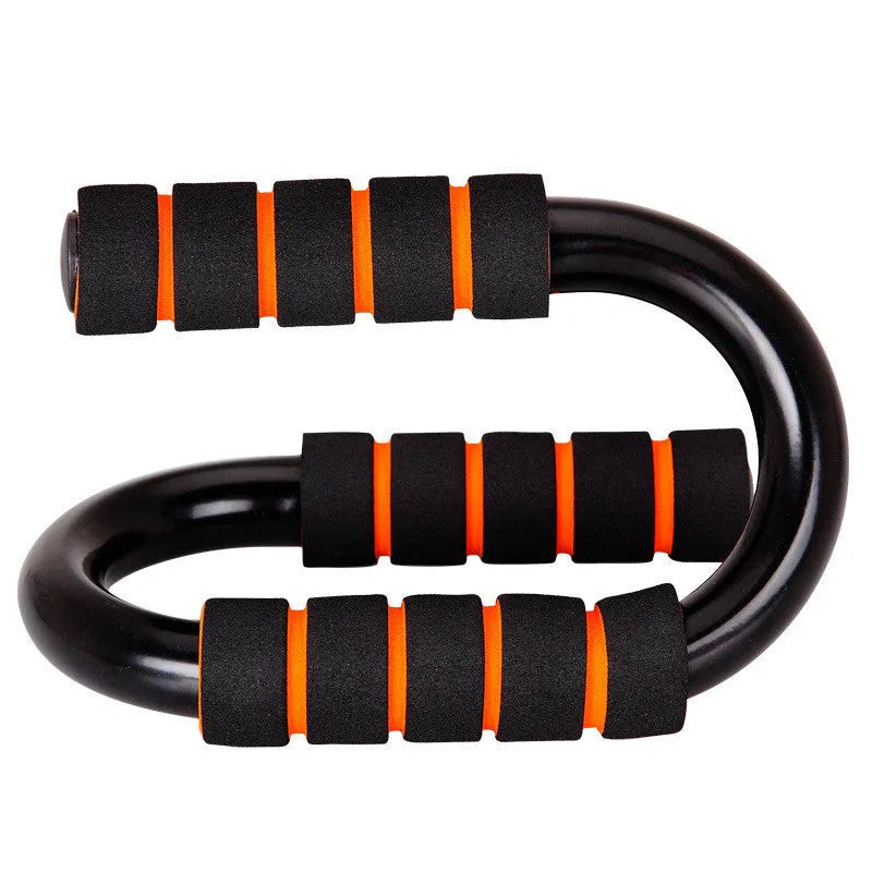 Black steel and foam push-up stand measuring 19x13x13cm on a gym floor