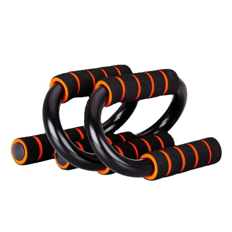 Black steel and foam push-up stand measuring 19x13x13cm on a gym floor