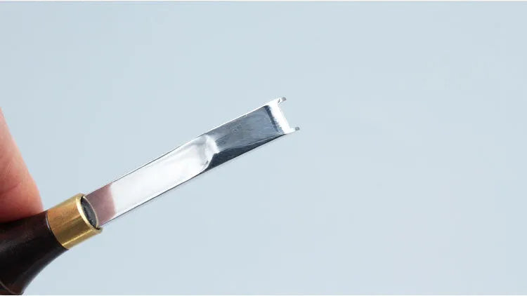 Shovel edge thinning knife with sectional cutting drum and leather handle.
