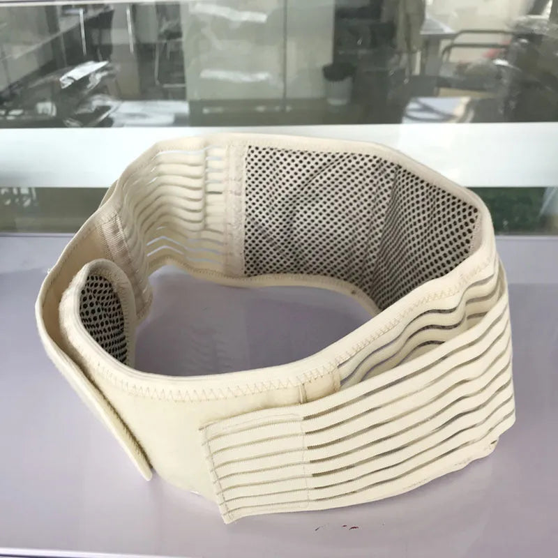Beige self-heating magnetic waist support belt for lumbar muscle strain on a neutral background.
