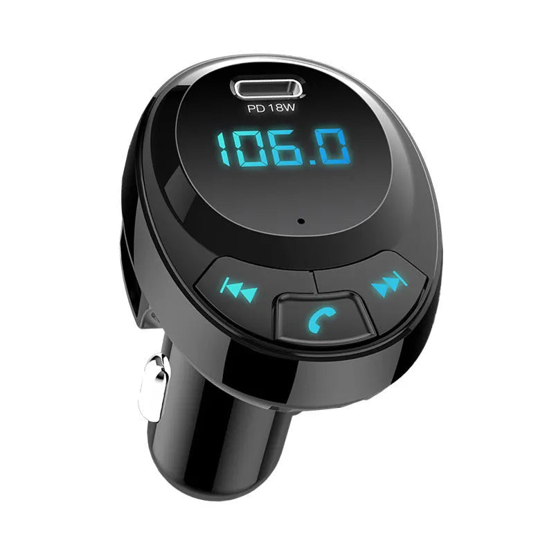 Black car Bluetooth MP3 charger with digital display and dual USB ports plugged into cigarette lighter