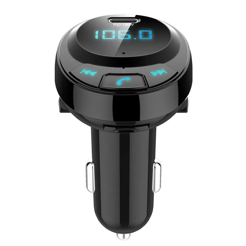 Black car Bluetooth MP3 charger with digital display and dual USB ports plugged into cigarette lighter