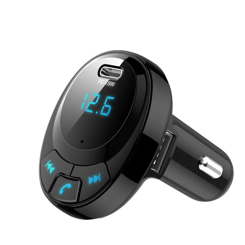Black car Bluetooth MP3 charger with digital display and dual USB ports plugged into cigarette lighter