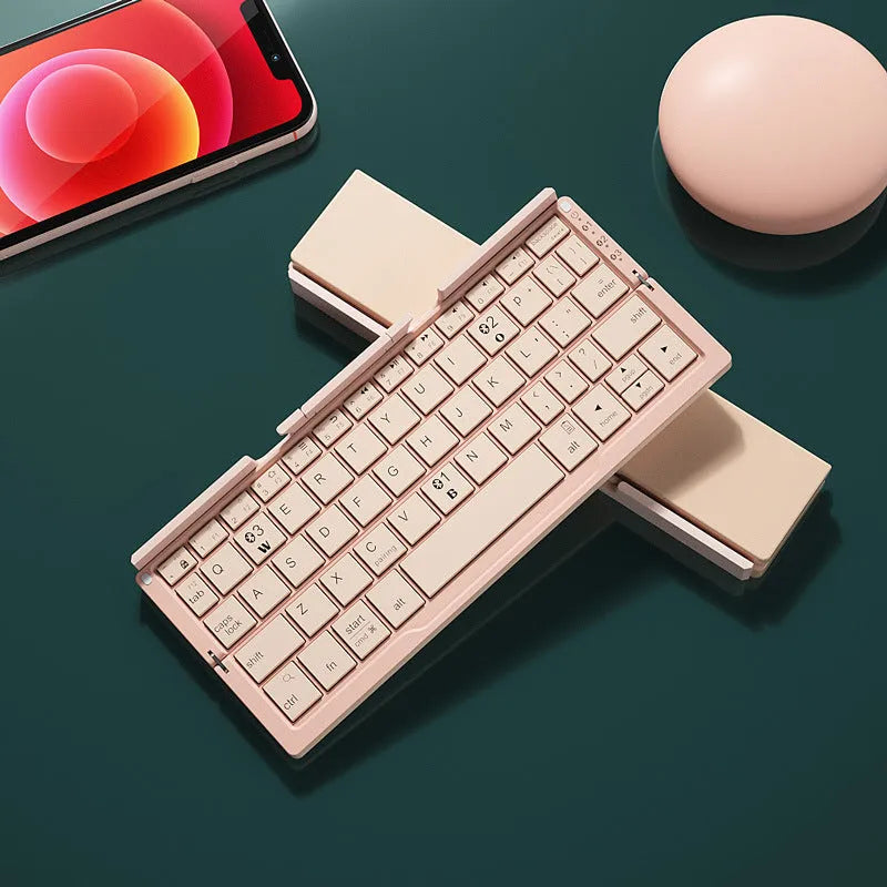 Aluminium folding Bluetooth keyboard in silver white colour showing open typing position and compact folded size