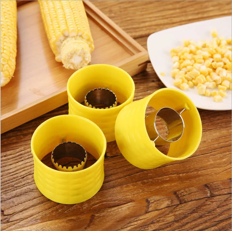 Yellow manual corn grinder thresher with PP grip and stainless steel gear for peeling corn kernels.