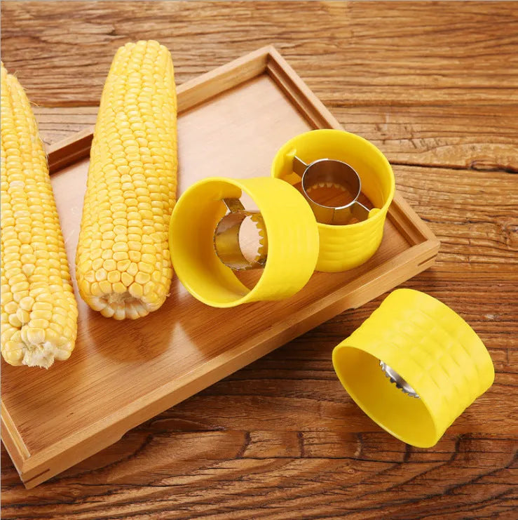 Yellow manual corn grinder thresher with PP grip and stainless steel gear for peeling corn kernels.