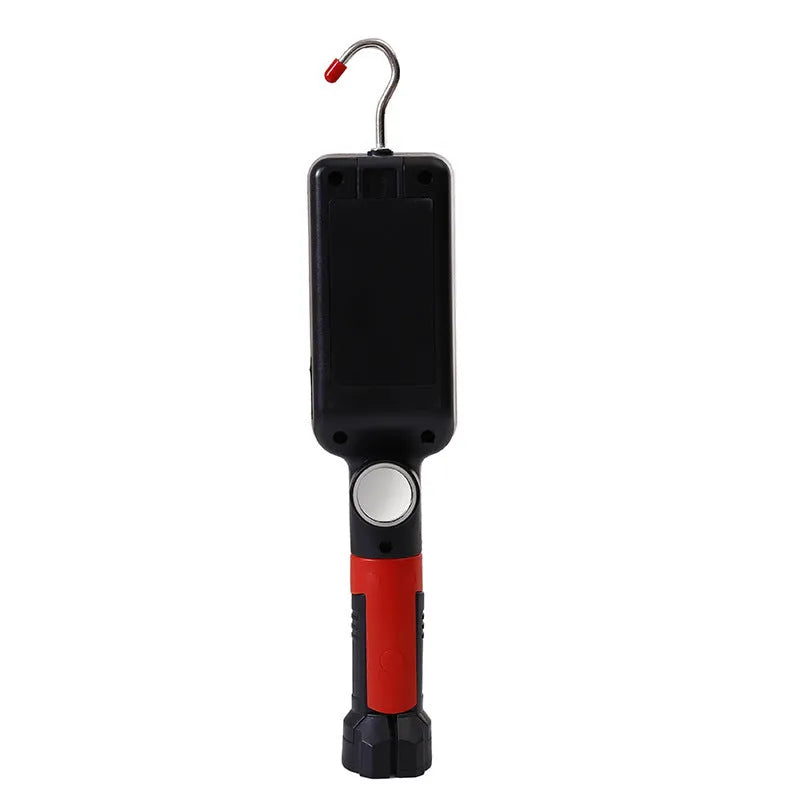 Red portable COB LED flashlight with USB cable and magnetic hook on metal surface