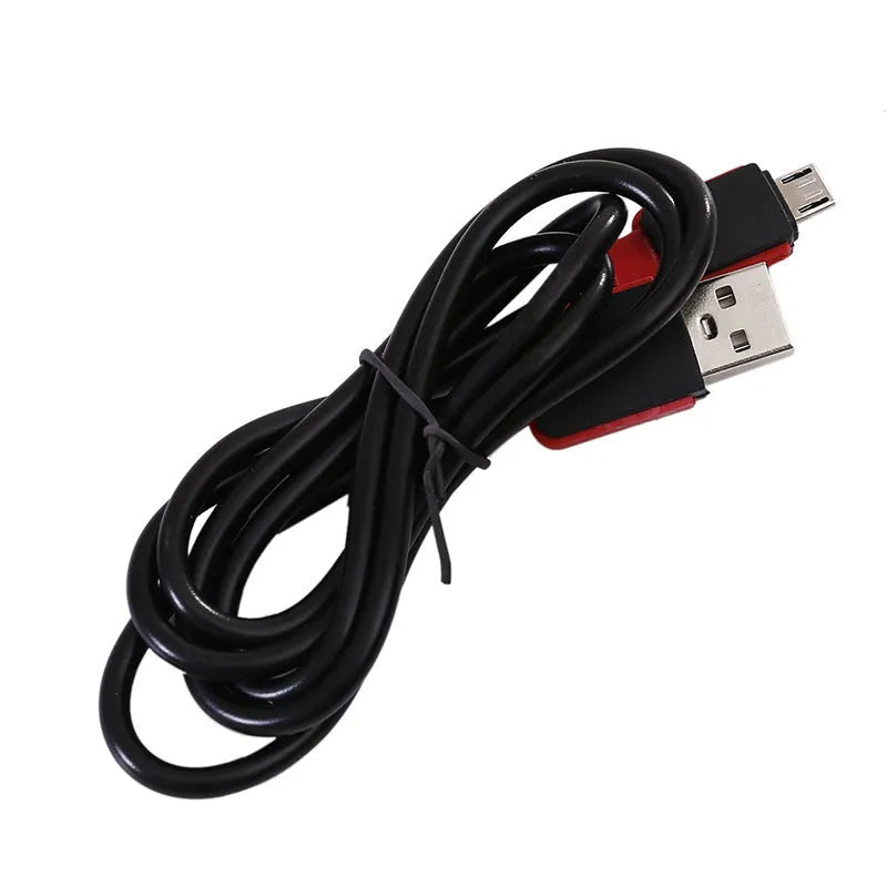 Red portable COB LED flashlight with USB cable and magnetic hook on metal surface