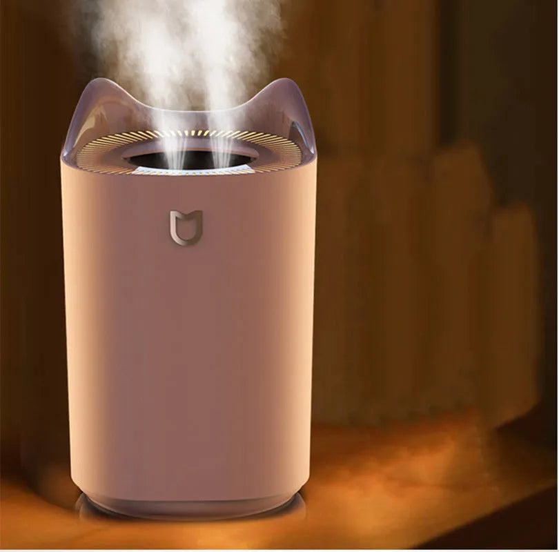 Double spray humidifier with three mist outlets in coral pink colour with USB cable