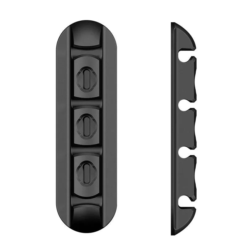 Black soft plastic desktop charging base stand with magnetic data cable organizer.