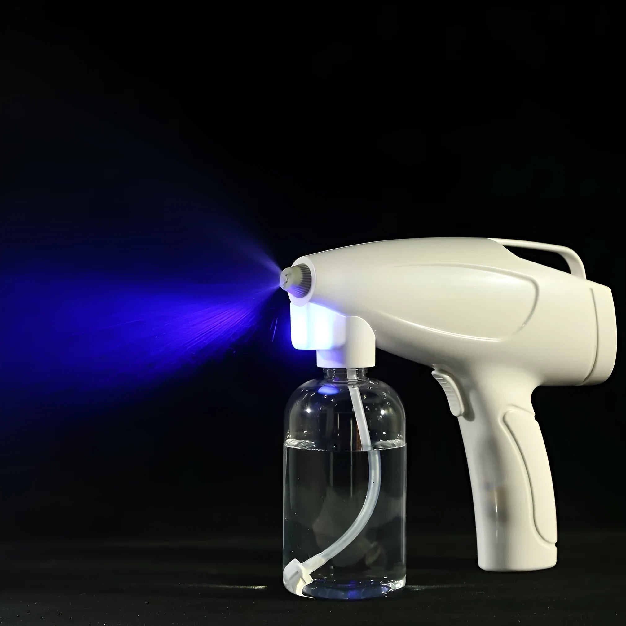 White handheld cordless electric spray disinfection gun with USB charging port.