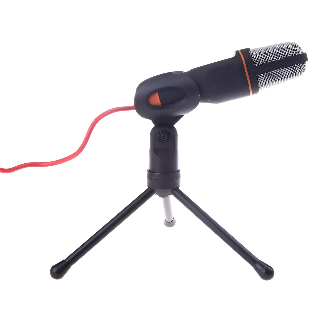 Black wired computer microphone with a detached metal clip holder on a white background.