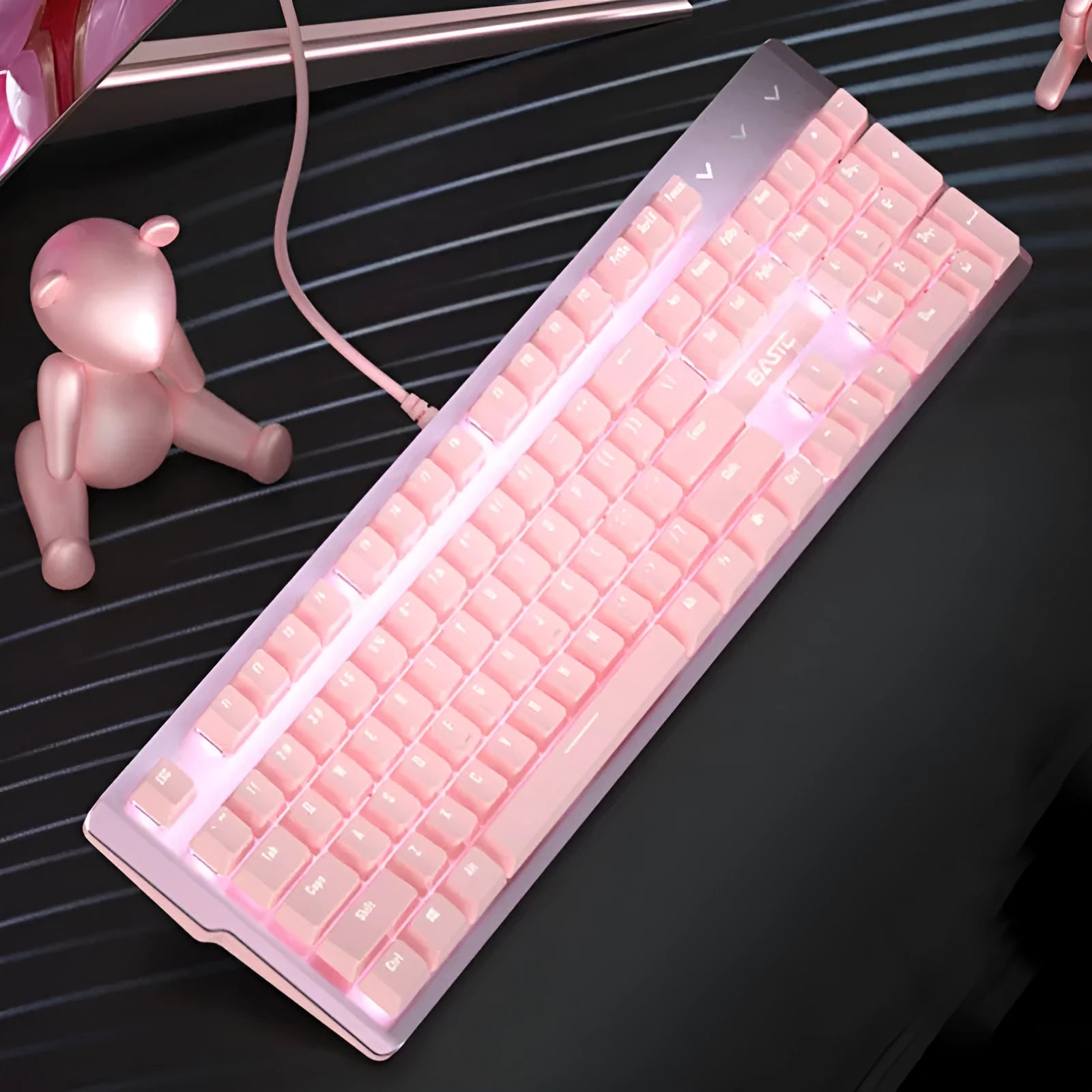 Pink mechanical gaming keyboard and matching wired mouse with rainbow backlit keys