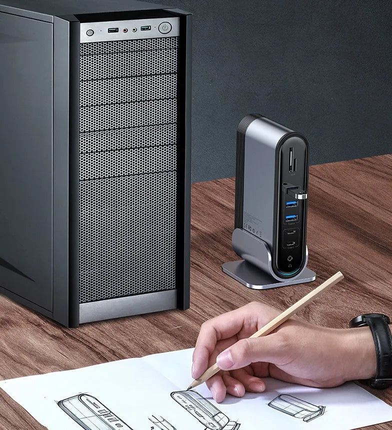 Deep space grey 16-in-1 Type-C docking station hub with multiple ports and optional power adapters on a desk.