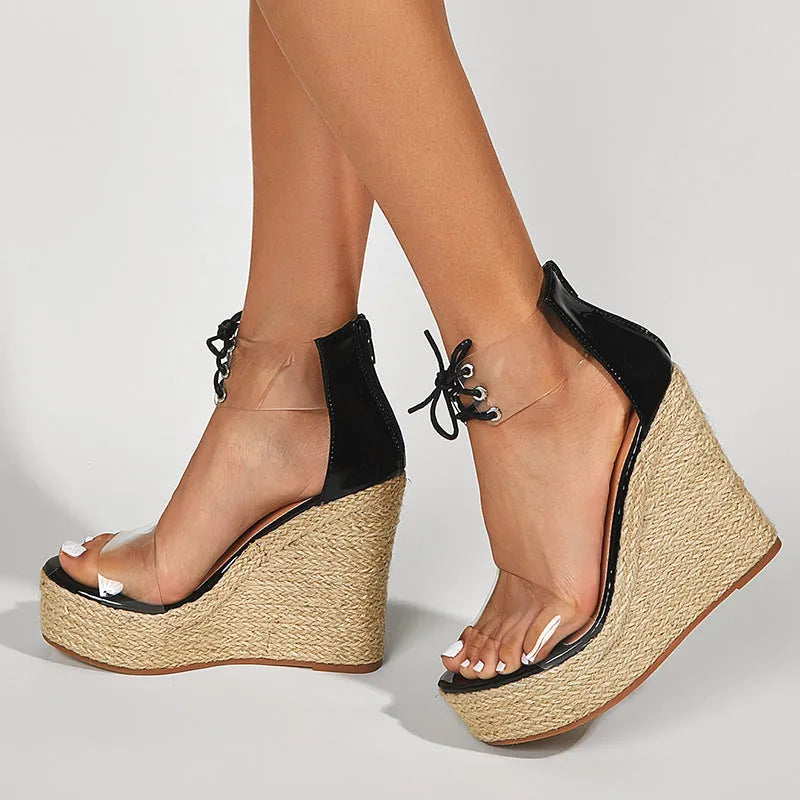 Black women's wedge sandals with hemp rope detail and a high front tie closure on an 8cm platform heel.