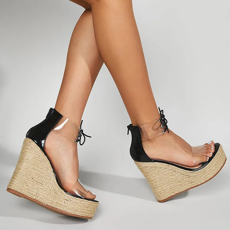 Black women's wedge sandals with hemp rope detail and a high front tie closure on an 8cm platform heel.