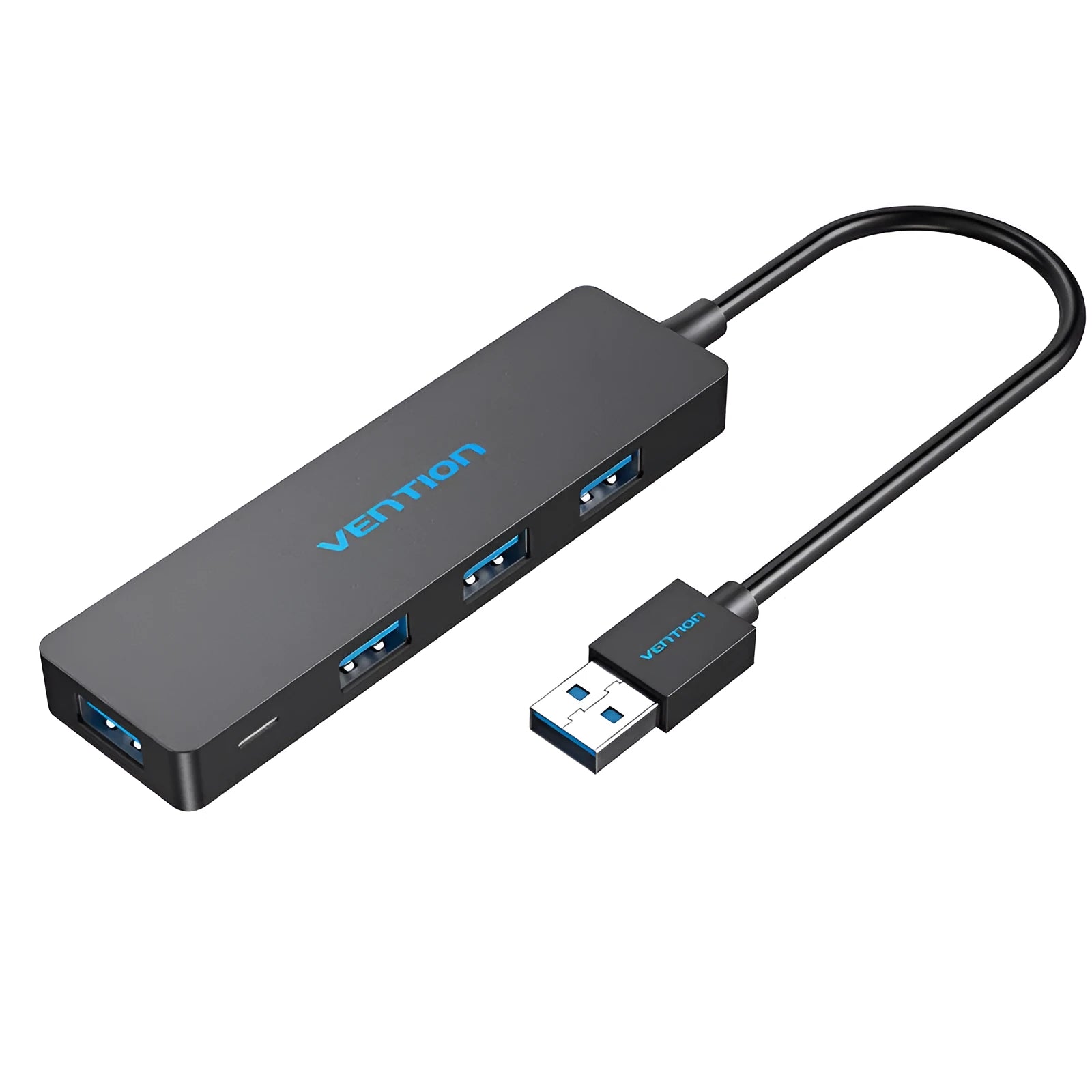 Black four-port USB 3.0 hub with a short cable on a desk next to a laptop