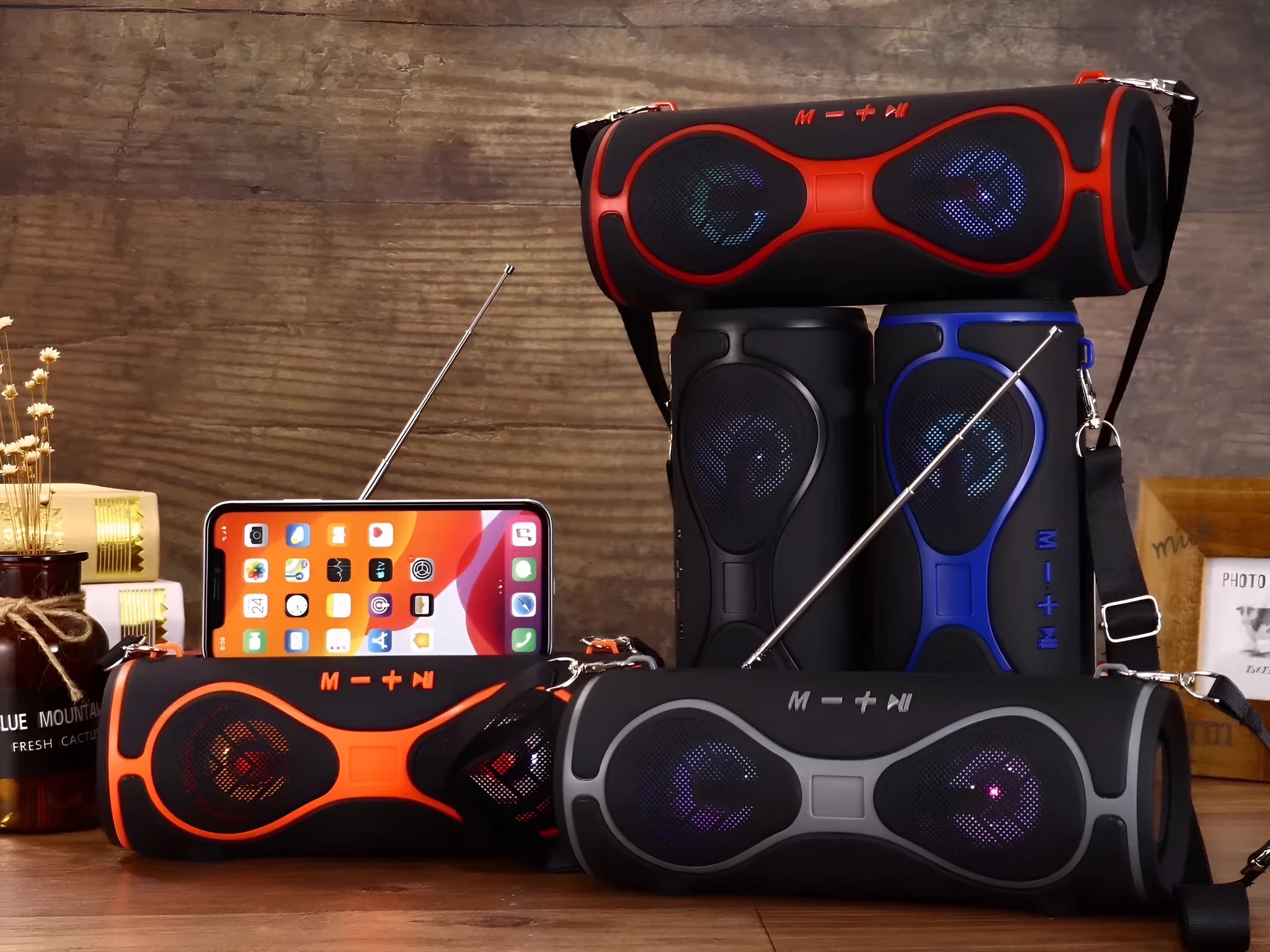 Multifunction Bluetooth speaker with adjustable strap and built-in phone stand in various colours