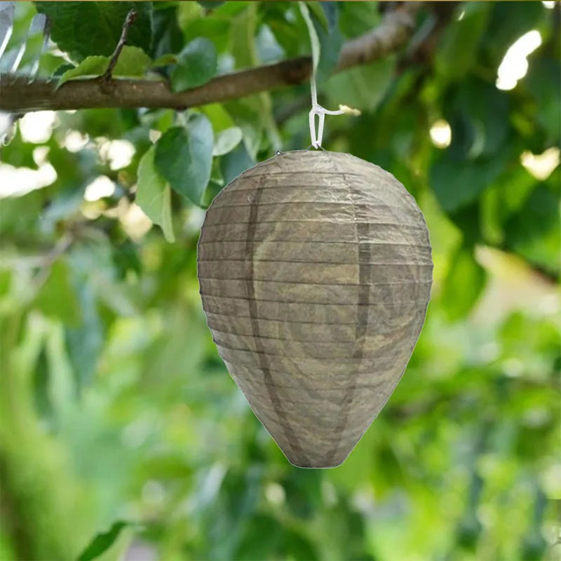 Paper and wire beehive lantern with honeycomb structure, 22 cm wide by 28 cm high.