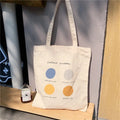 Women's medium canvas tote bag with geometric pattern in light pink colour showing interior cotton lining and zipper pocket