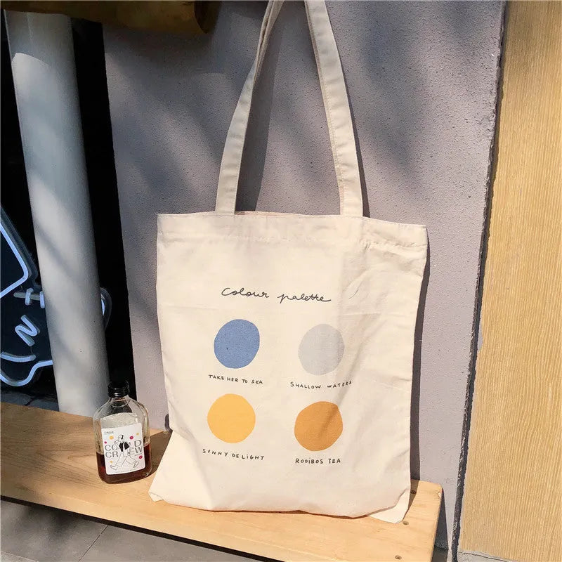 Women's medium canvas tote bag with geometric pattern in light pink colour showing interior cotton lining and zipper pocket