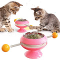 Rotatable plastic cat toy with turntable and catnip balls in a choice of colours.
