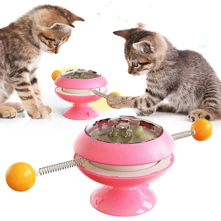 Rotatable plastic cat toy with turntable and catnip balls in a choice of colours.