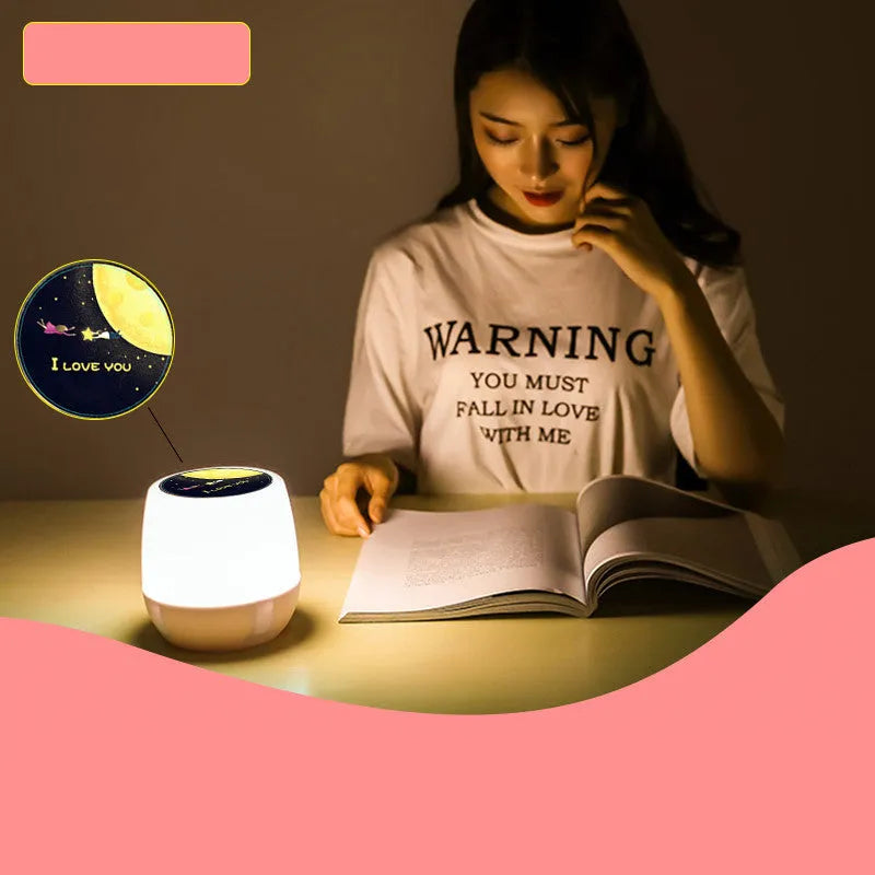 Pruixin LED projector night light projecting rotating star and moon patterns on a bedroom wall.