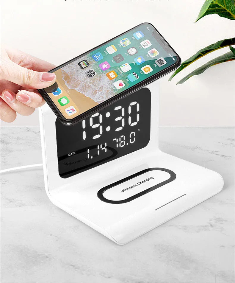 Wireless charger alarm clock with digital display showing time, calendar, temperature and humidity readings