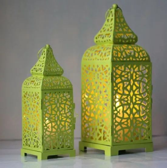 Geometric hollow metal candelabra in retro design for tabletop decoration.