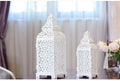Geometric hollow metal candelabra in retro design for tabletop decoration.