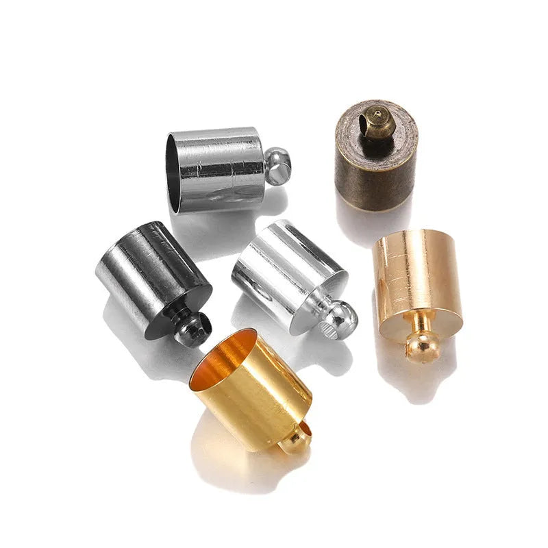 Assortment of electroplated copper bell-shaped tassel caps in various colours and sizes for jewellery making.