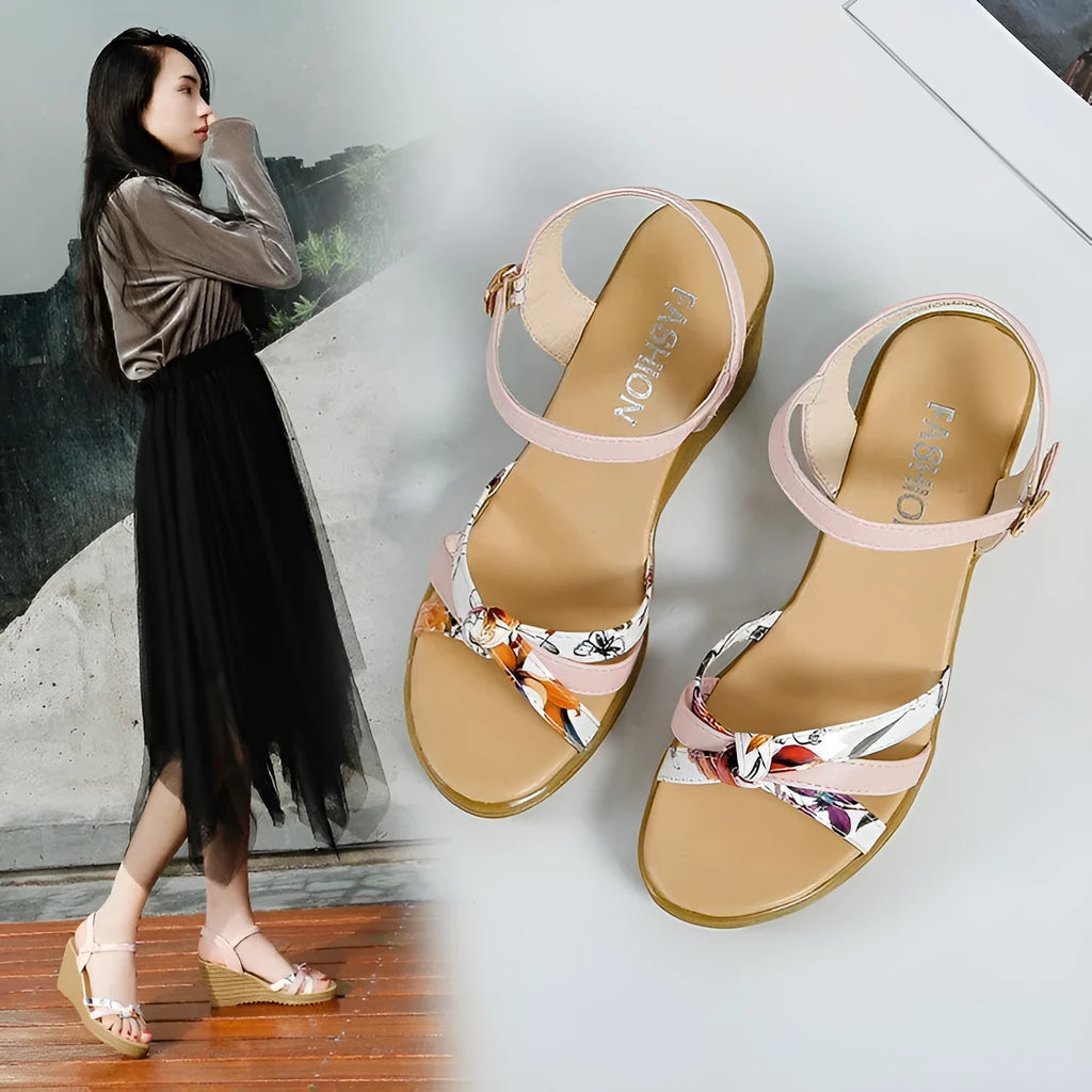 Women's pink wedge sandals with a thick heel, buckle strap, and non-slip sole.