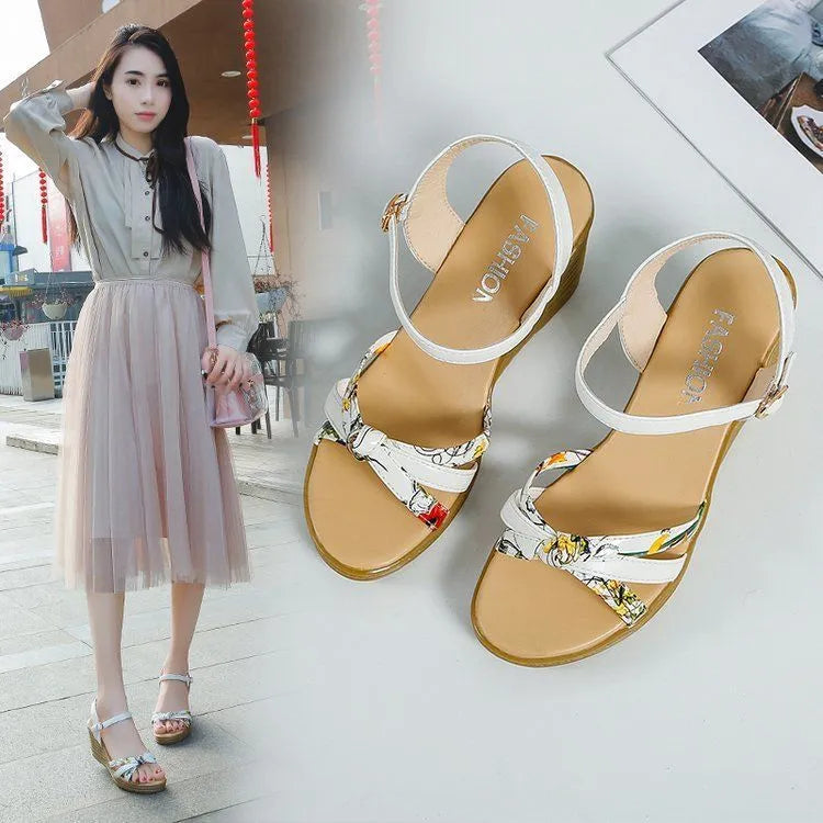 Women's pink wedge sandals with a thick heel, buckle strap, and non-slip sole.