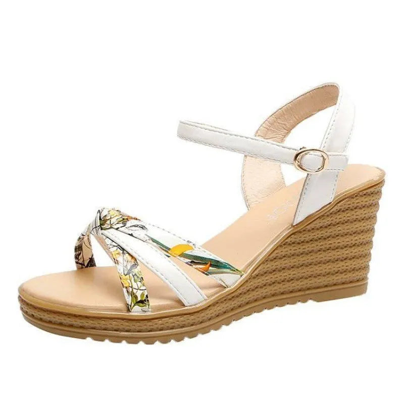 Women's pink wedge sandals with a thick heel, buckle strap, and non-slip sole.