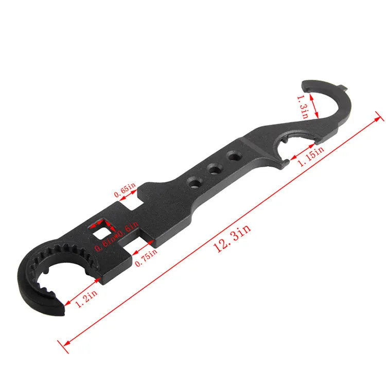 Black all-steel combination wrench for AR15 and M4 rifle maintenance on a workshop bench.