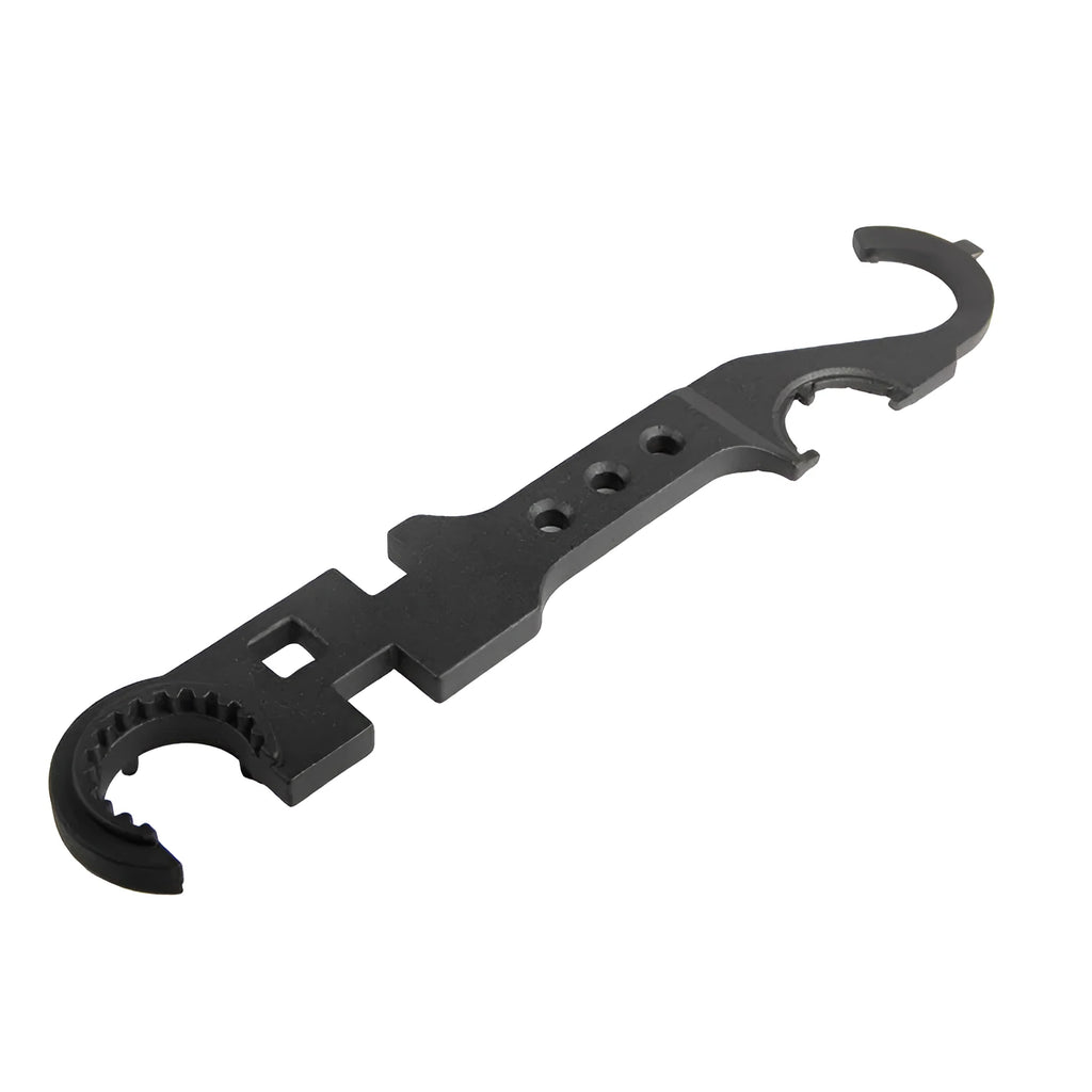 Black all-steel combination wrench for AR15 and M4 rifle maintenance on a workshop bench.