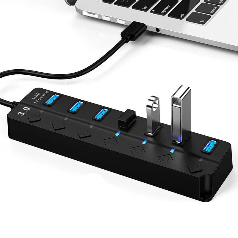 Black 7-port USB 3.0 hub with external power supply unit for desktop computer expansion