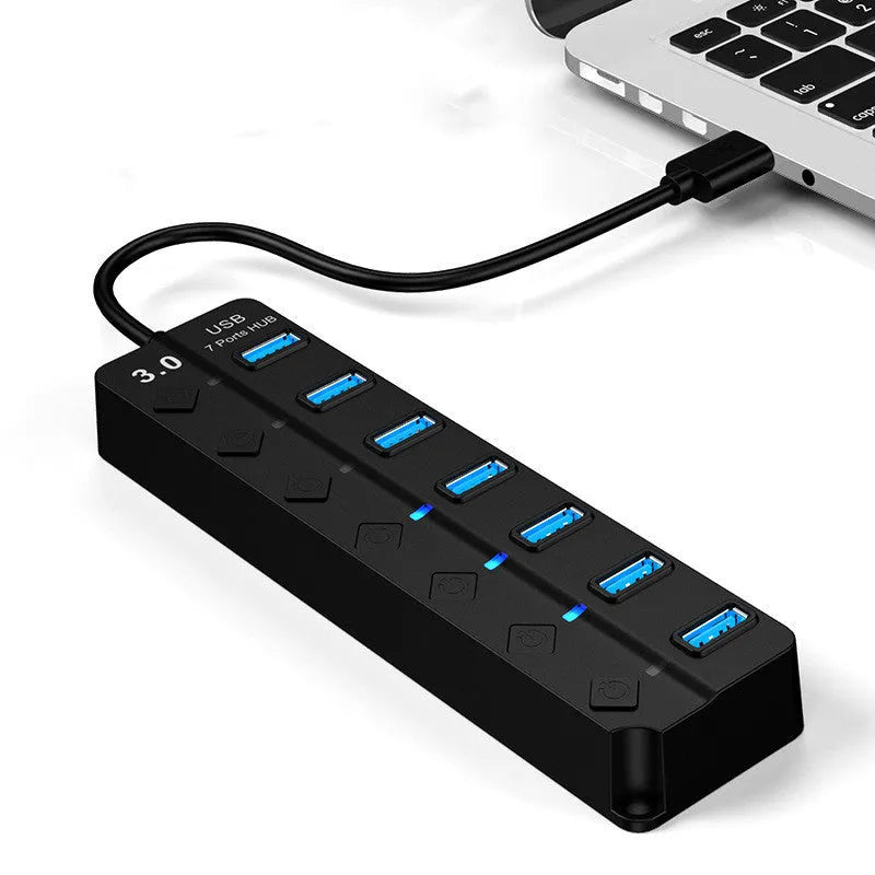 Black 7-port USB 3.0 hub with external power supply unit for desktop computer expansion