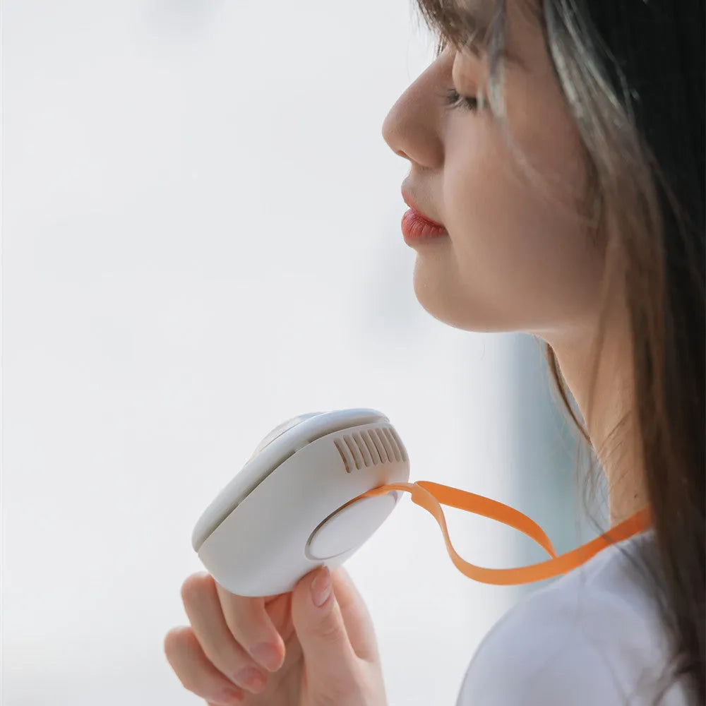 White squirrel design handheld neck fan showing USB port and mechanical controls