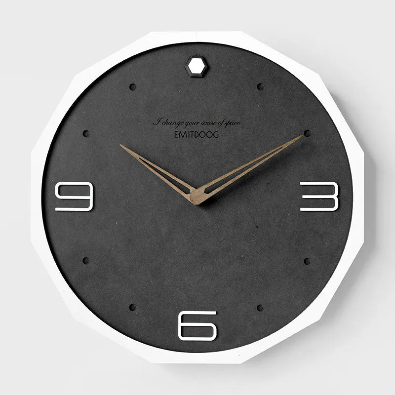 12 inch round Nordic minimalist wall clock with free-perforated Geralt mirror face on a wall