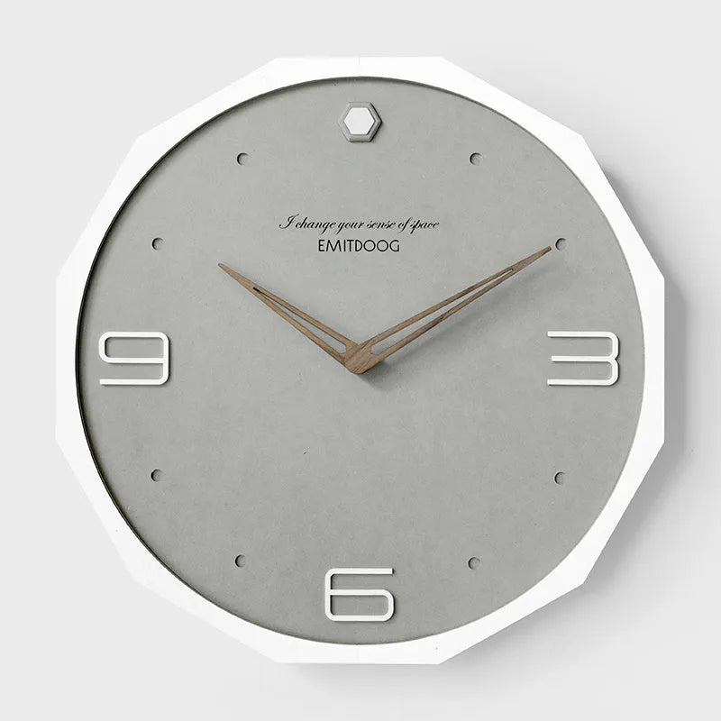 12 inch round Nordic minimalist wall clock with free-perforated Geralt mirror face on a wall