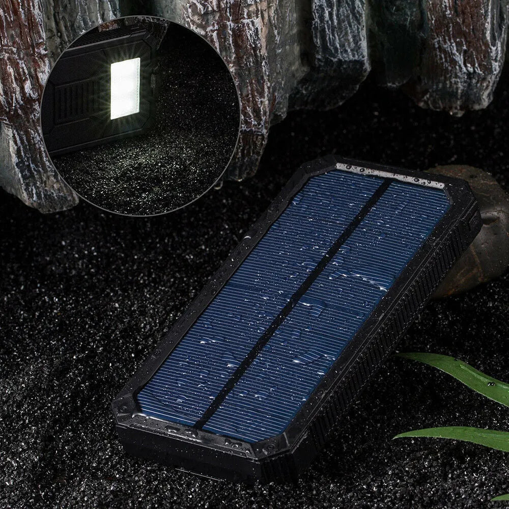 Orange 20000mAh solar power bank showing solar panel and multiple USB ports.